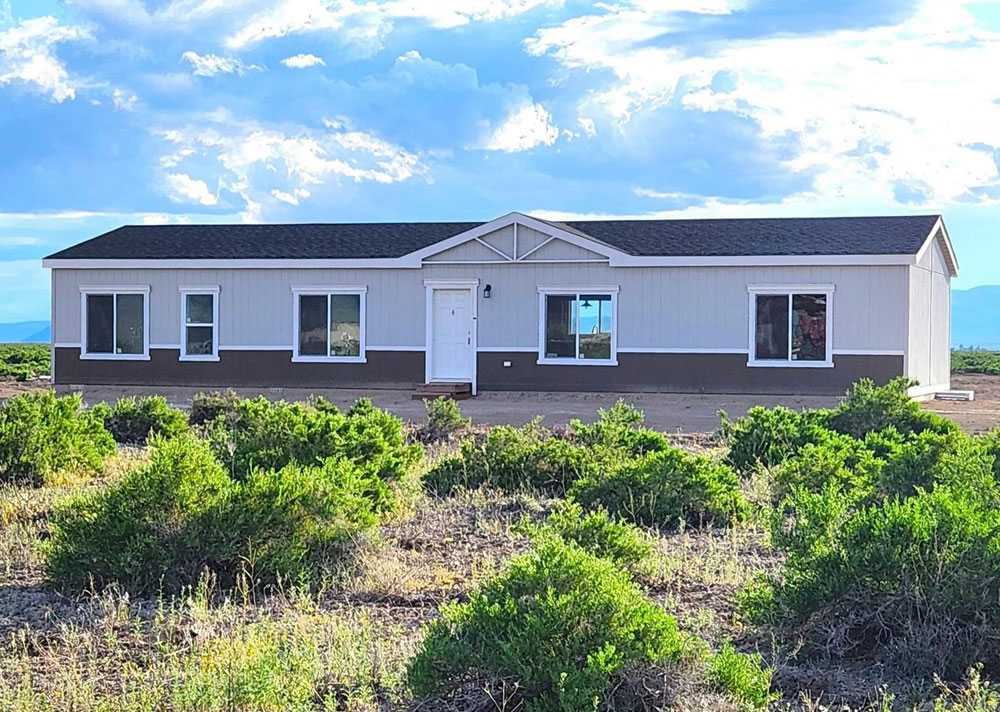 Prestige Series 28664E The Rapids exterior view with lush sage brush