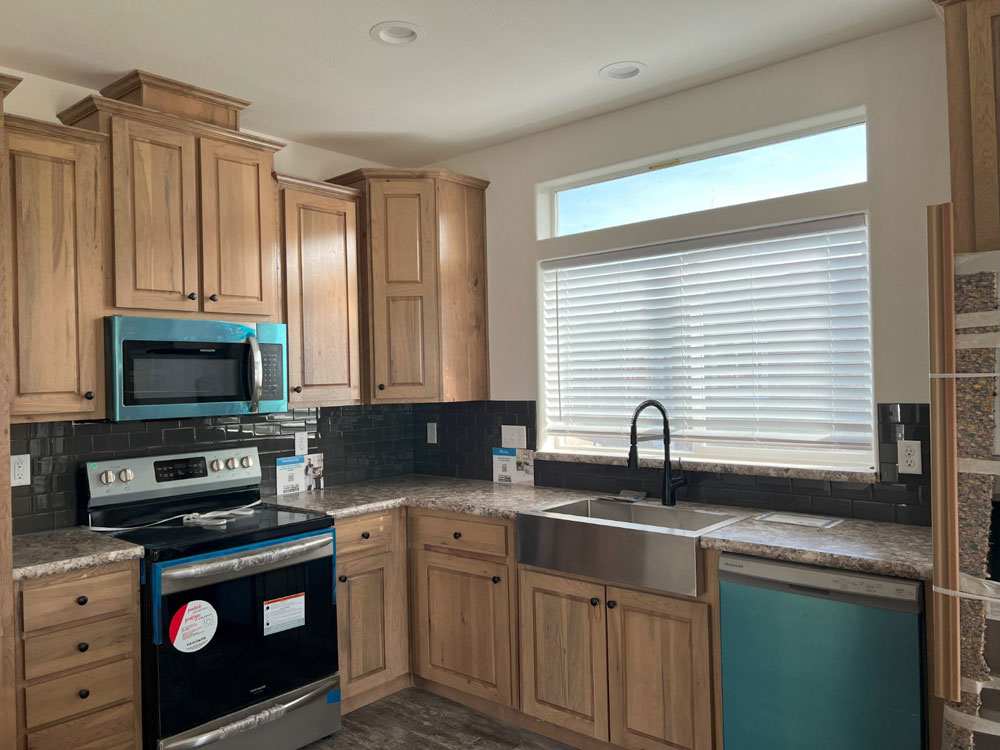Huge farmhouse sink and hardwood cabinets in the Marlette Columbia River