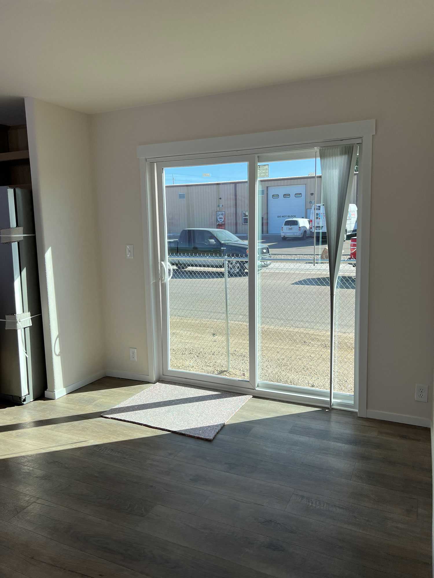 Broadmore 28764T: Large dining room with sliding glass door for natural light