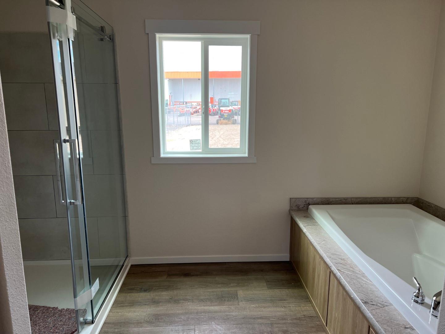 Luxurious master bath in the 28764T with walk-in tile shower and soaker tub