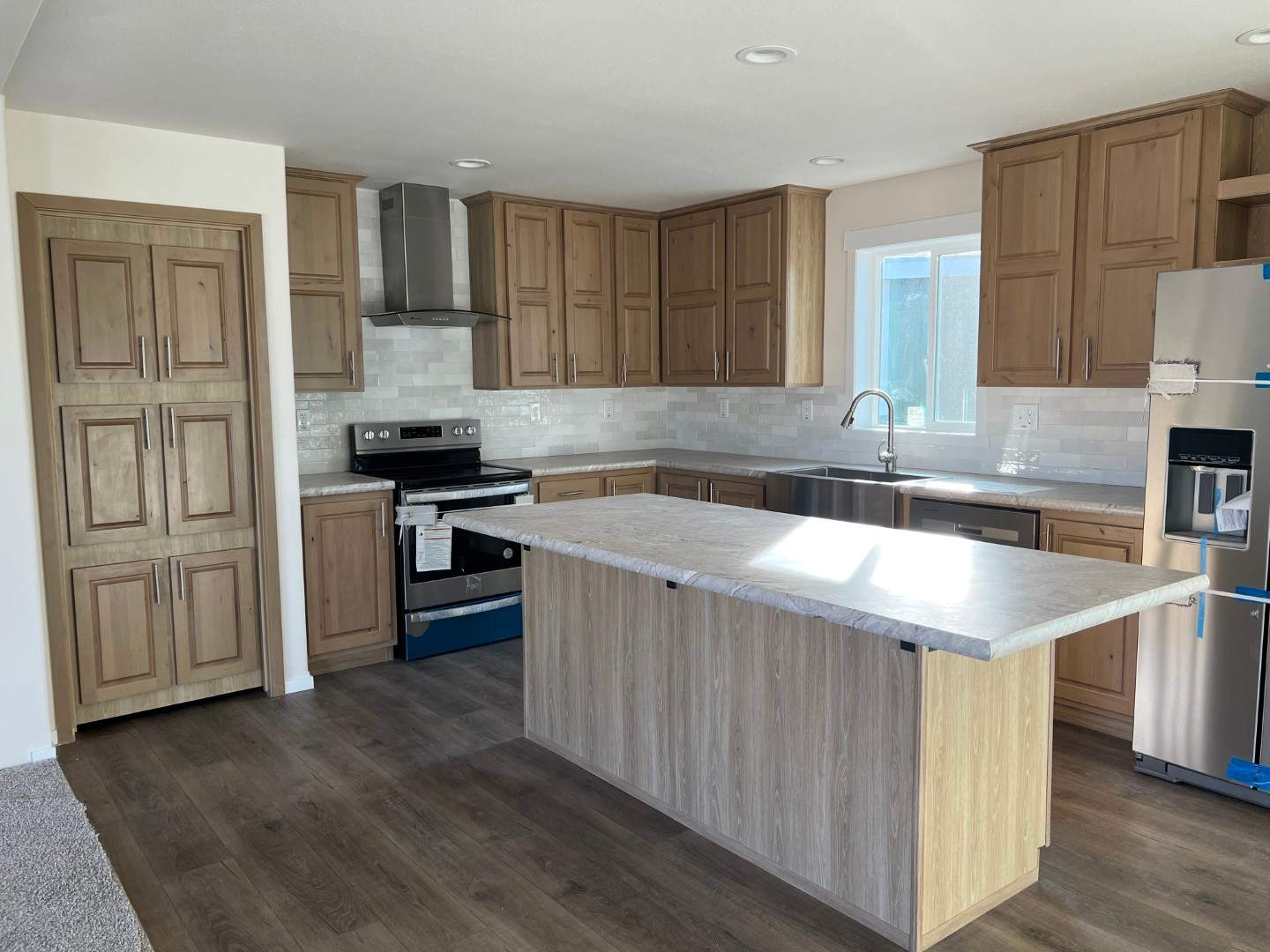 Hidden pantry adds ample storage to The Sawtooth’s spacious kitchen.