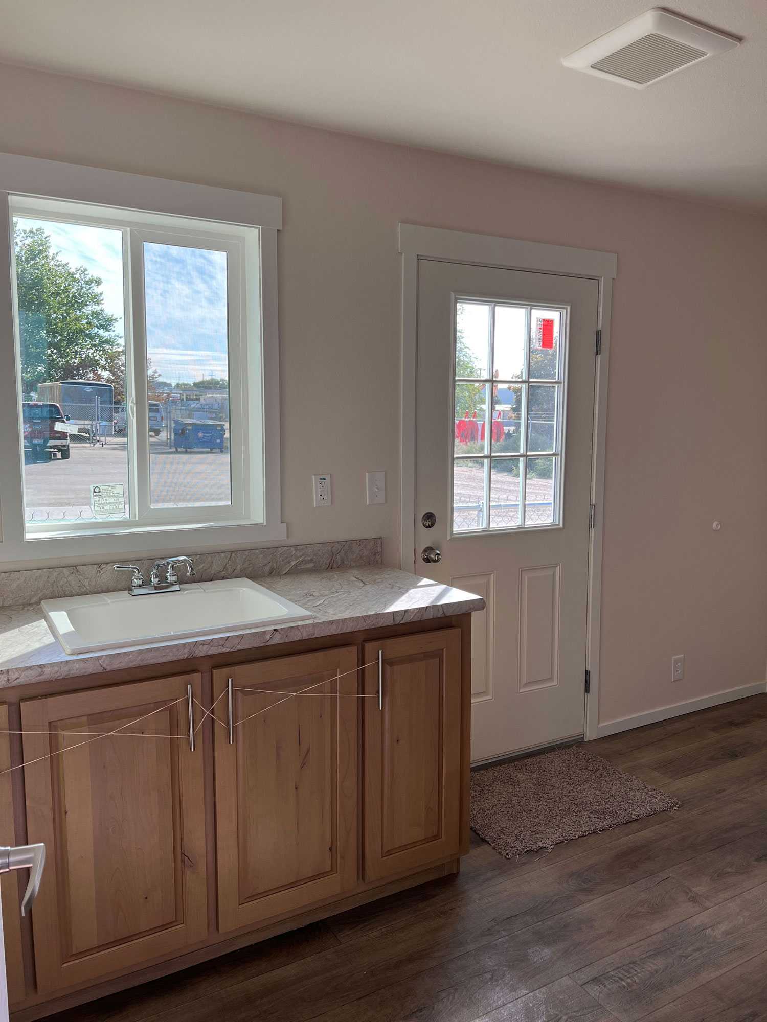 Convenient laundry room with extra storage in The Sawtooth by Fleetwood