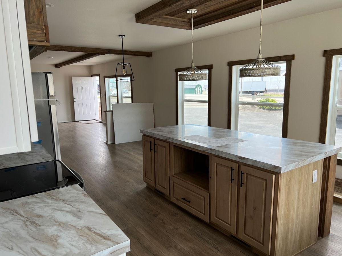 Centerpiece island highlights The Clover kitchen by Fleetwood Homes.