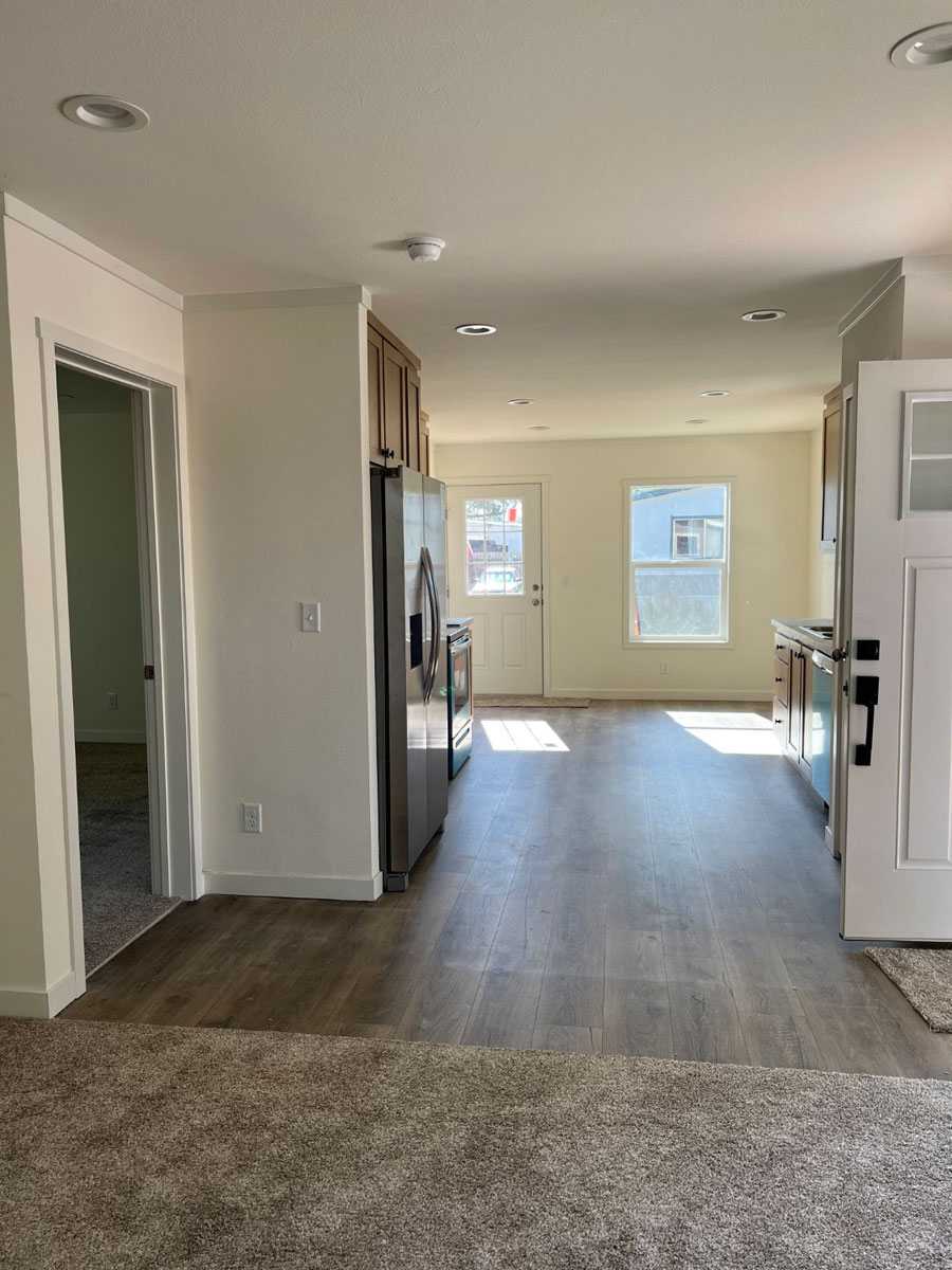 Open-concept living space in the Clayton Tempo Here Comes the Sun home