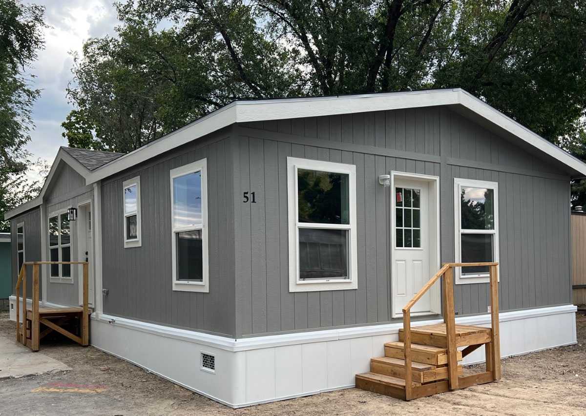 End exit door with durable skirting on the Here Comes the Sun multi-section home