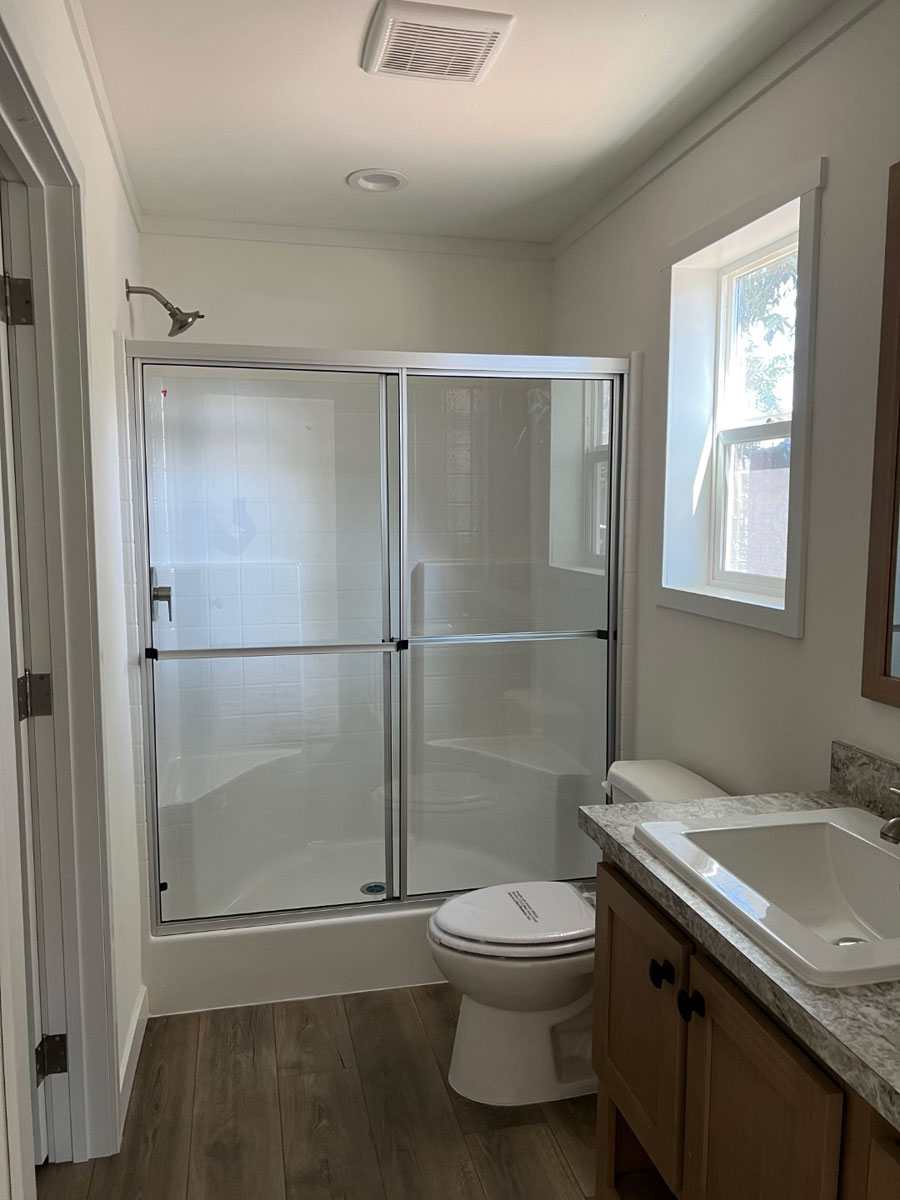 Large walk-in shower in the Clayton Tempo Here Comes the Sun 3-bedroom home