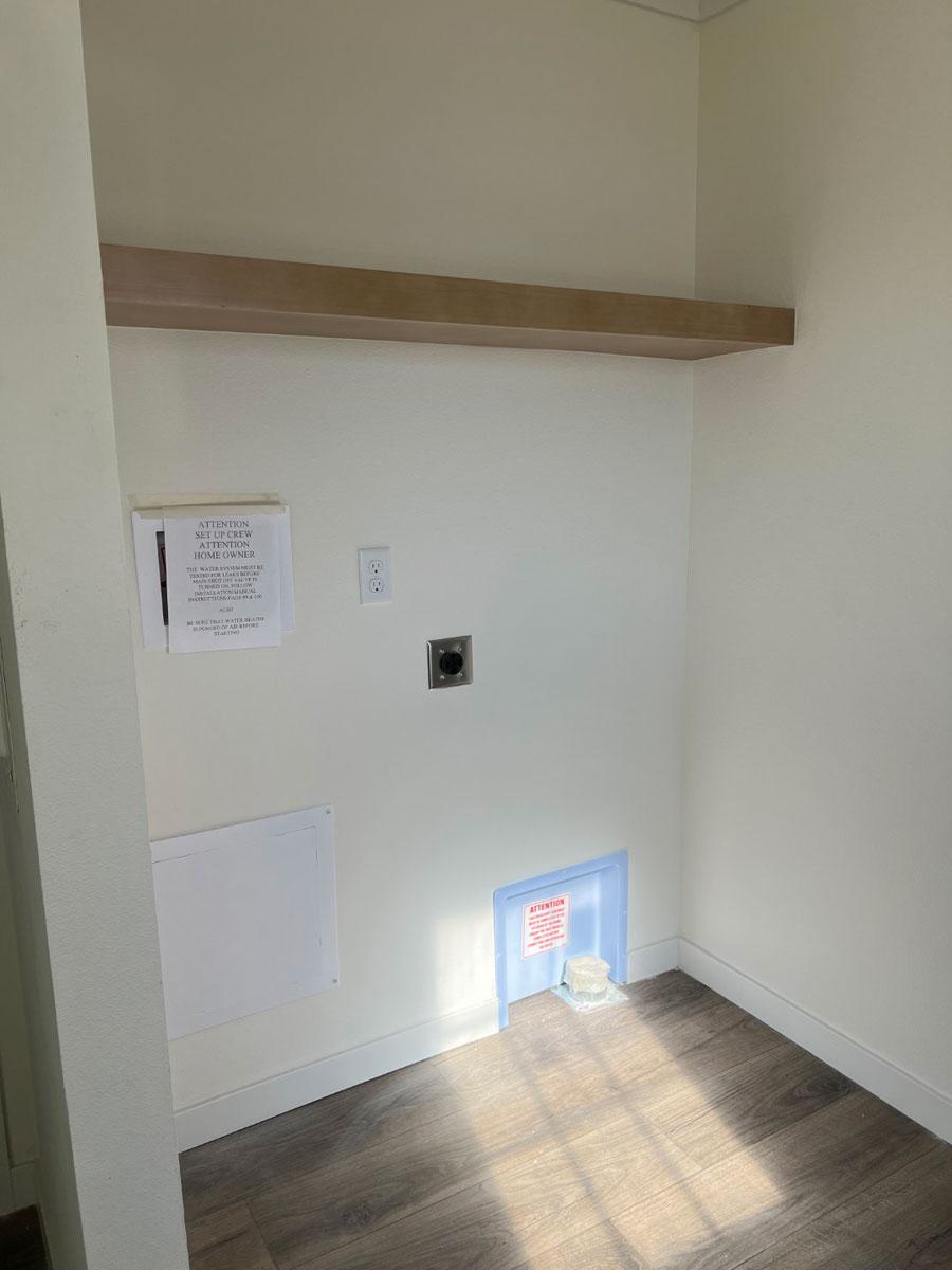 Efficient utility room in the Tempo Imagine by Clayton Mobile Homes