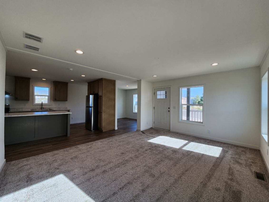 Open kitchen and living area in Johnny B Goode by Marlette Homes, Nampa, ID