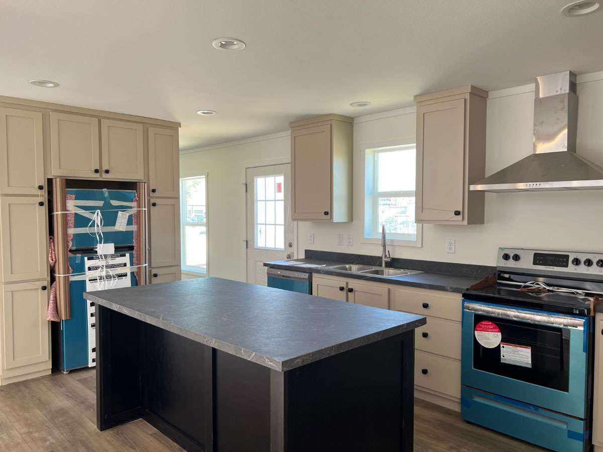 Modern kitchen with stainless steel appliances in Rocket Man.