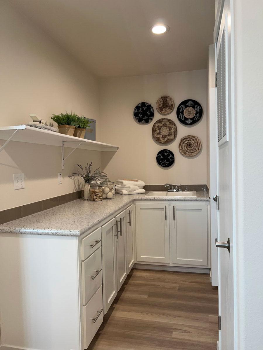 Pantry and functional laundry room in the 30684E The Shoshone