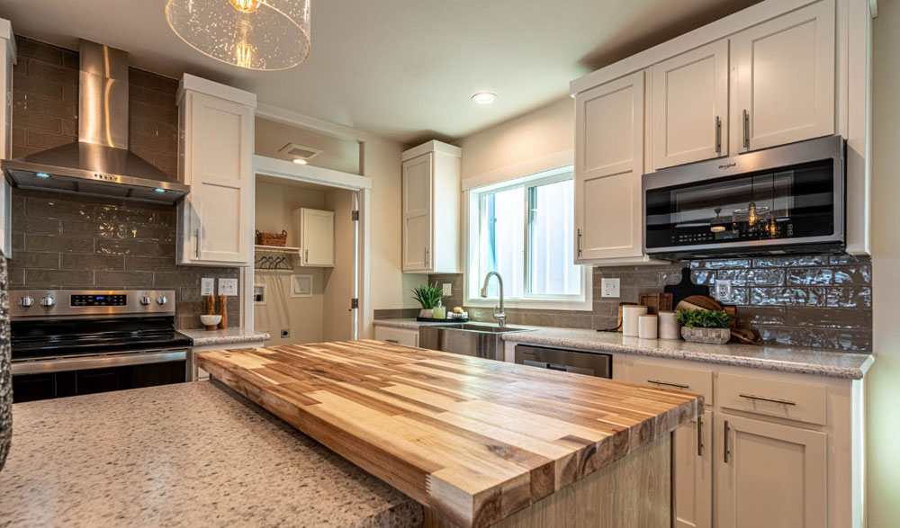 T-shaped island with butcher block countertops in the 30684E