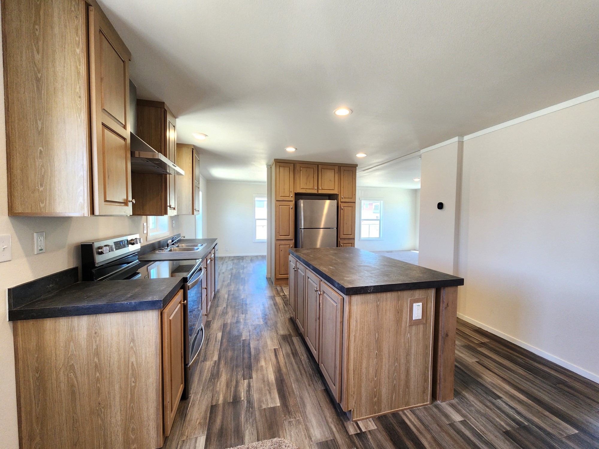 Huge kitchen island in this 3-bedroom home by Fleetwood Manufactured Homes.