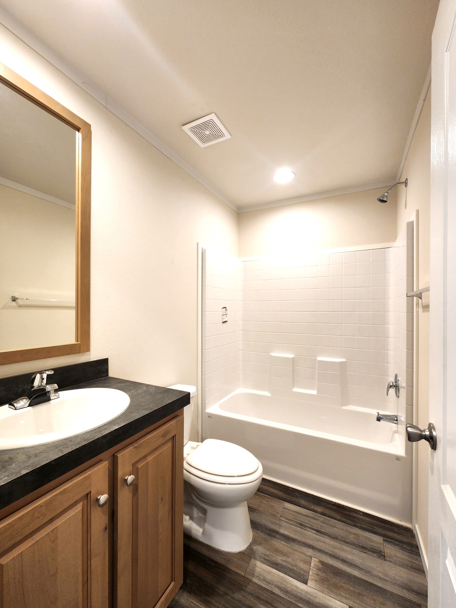 Second bath is functional and charming in this Fleetwood Mobile Home.